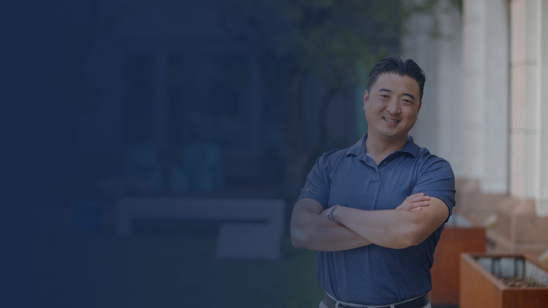 Man standing smiling outside