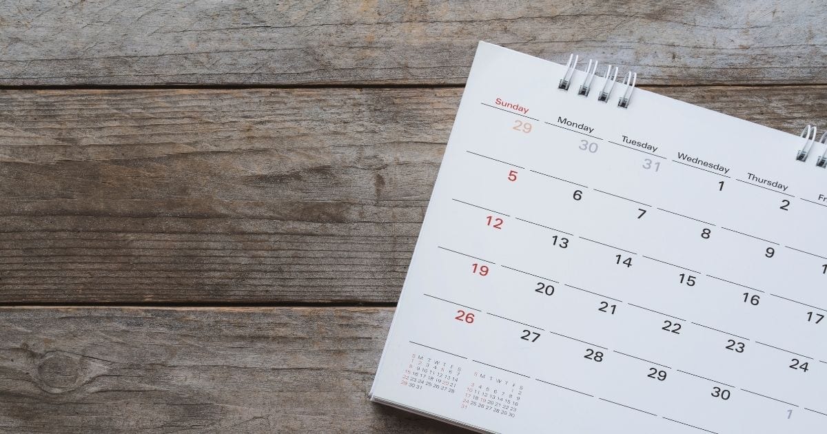 Employee Benefits Compliance Alert, calendar on a table