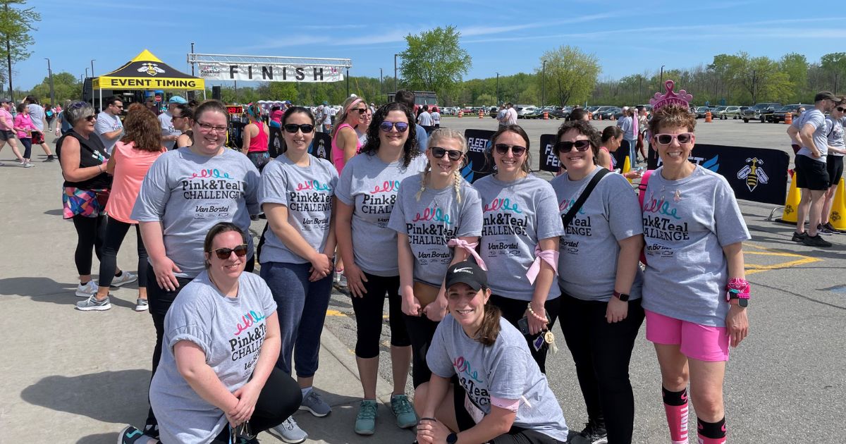 women in grey t-shirts at a charity run/walk for breast cancer while working for one of the best accounting firms to work for