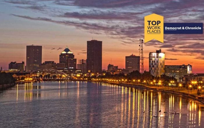 2022 Rochester's Top Workplaces award with skyline of city of Rochester at night